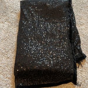 Black sequenced saree with velvet border snd tassel in the pallu